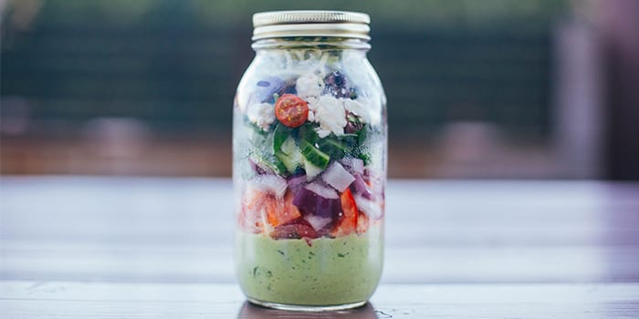 Greek zucchini salad in a jar great to meal prep your lunch.