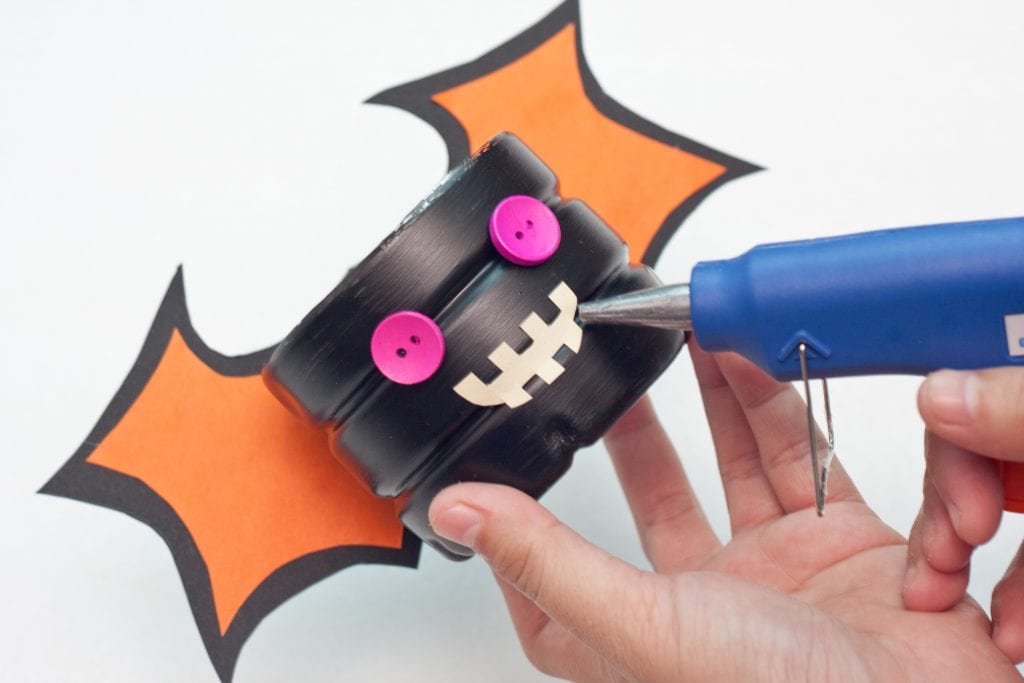 Halloween DIY Craft: Trick or Treat Basket Step 10 Glue mouth on body of bat.