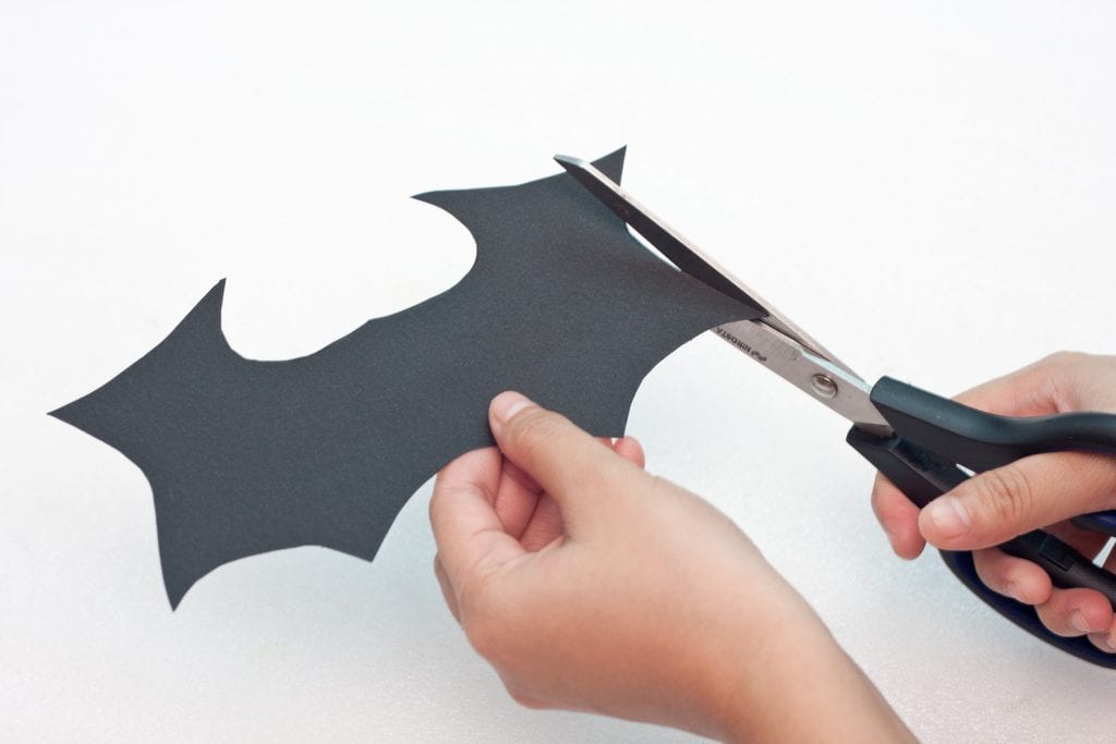 Halloween DIY Craft: Trick or Treat Basket Step 4 Cut out a bat from black construction paper. 