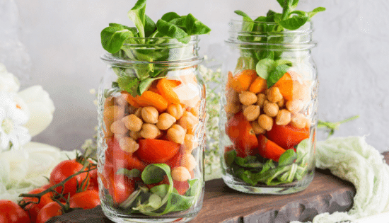 Ball Mason Jars being used for meal prep full of veggies.