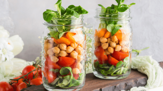 Ball Mason Jars being used for meal prep full of veggies.